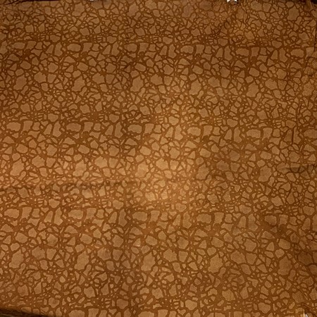 Helt lammskinn mönstrat 39 rödbrunt med fläckar ca 65x65cm restparti